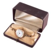Rolex, a vintage ladies gold wristwatch the round white dial having black Arabic numerals,
