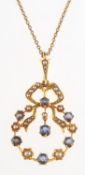 A Victorian sapphire and seed pearl pendant with chain,