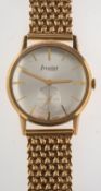 Accurist a gold gentleman's wristwatch the round silvered dial having raised gold baton numerals,