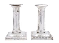 A pair of Edward VII silver dwarf candlesticks by Goldsmiths & Silversmiths Company Ltd,