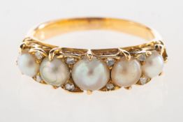 A Victorian pearl and diamond ring, a half hoop ring set with five split pearls,