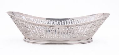 An Edward VII silver breadbasket by William Comyns & Sons, London 1908, of boat shape,