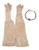 A Debutant's white kid leather gloves and a tiara,