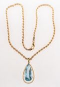 A blue topaz pendant with chain,