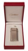Cartier. A boxed white metal Cartier lighter, stamped no. 187297 'Swiss Made' to the base, approx.