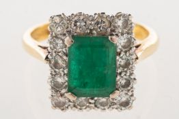 An emerald and diamond cluster ring,