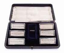 A cased set of six Edward VII silver napkin rings by Sampson Mordan & Co Ltd, Chester 1909,