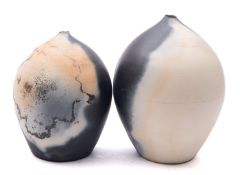 Two white stoneware vases of oviform tap