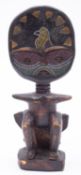 An African stained wood and beadwork inl