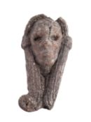 A relief carved wood mount modelled as a