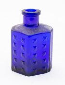 A group of green, brown and blue glass b