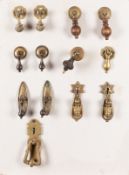 A collection of metal door handles and o