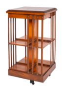 A burrwood and marquetry revolving bookc