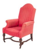 A Victorian upholstered armchair in Quee