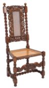A carved oak and caned side chair in Wil