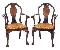 A pair of Edwardian mahogany open armcha
