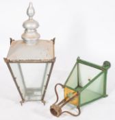 Two painted metal and glazed lanterns, l