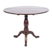 An 18th Century oak circular tea table,