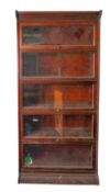 A mahogany and glazed sectional stacking