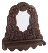 A Victorian carved oak framed wall mirro