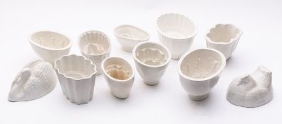 A group of pottery jelly moulds of anima