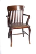 An Edwardian beechwood office armchair,