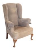 A beechwood wing frame armchair, in the
