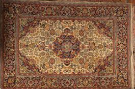 A machine made carpet of Persian pattern