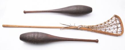 A pair of stained pitch pine Indian club
