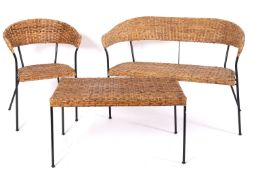 A rattan worked and black painted metal