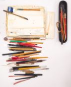 A collection of various dipping pens.