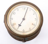 A brass bulkhead clock, unsigned, the 5