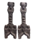 A pair of substantial cast iron andiron