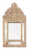 A pressed metal cushion framed mirror, 60cm high.