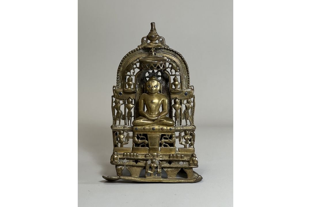 A Bronze Jain shrine. India 15th century.A Jain shrine depicting a Tirthankara with silver inlaid - Image 2 of 18