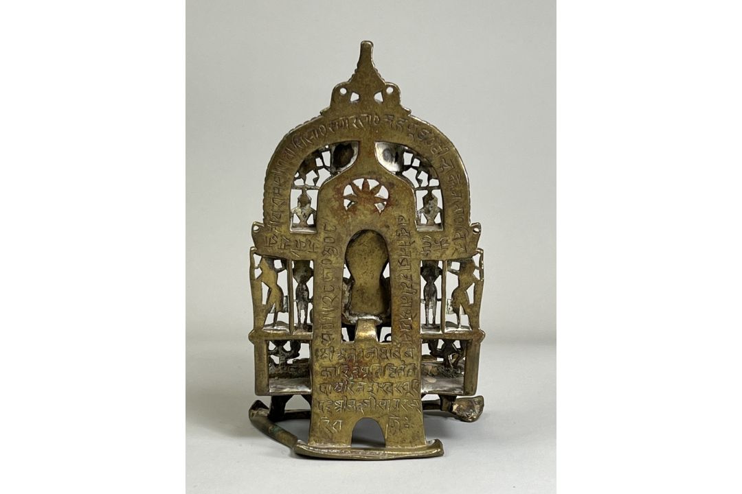 A Bronze Jain shrine. India 15th century.A Jain shrine depicting a Tirthankara with silver inlaid - Image 3 of 18