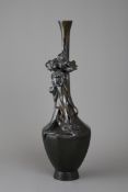 A Japanese Bronze Iris Vase, Meiji periodthe elegant tall bottle vase of hexagonal section with