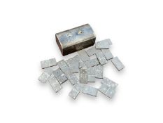 An unusual Miniature Pewter Chest, containing dominoes, 19th century  L:3.8cm.