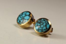 A Pair of Turquoise Matrix and Yellow Gold Earstuds,Each circular stud within a rub over 9 carat