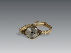 A Lady's 9 carat Yellow Gold Wristwatch by Jaquet -Droz, circa 1950,the circular dial with black