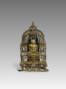 A Bronze Jain shrine. India 15th century.A Jain shrine depicting a Tirthankara with silver inlaid
