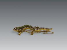 An Antique Demantoid Garnet,Split Pearl and 18 ct Yellow Gold Lizard Brooch, circa 1890, the body