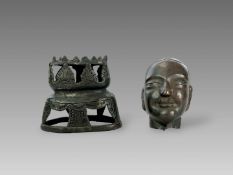 A Repousse Copper Monk's Head, and an openwork Bronze Lotus Stand, c.1800A Repousse Copper Monk's