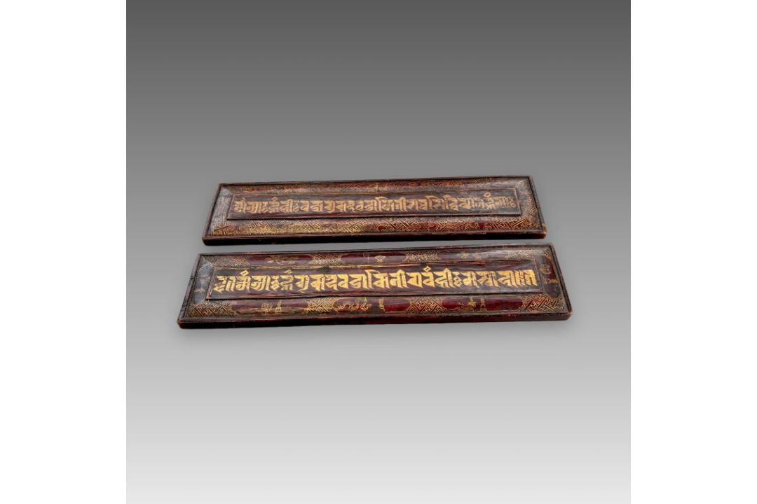 A Pair of inscribed Sutra Covers, Nepal, 19/20th centuryin gilt on red, the inscription with - Image 1 of 5