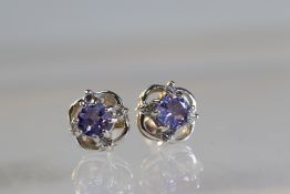 A Pair of Iolite and Diamond Cluster Earrings A Pair of Iolite and Diamond Cluster Earrings, mounted