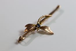 An Antique 9 ct Yellow Gold and Sapphire Dragonfly Bar Brooch An Antique Yellow Gold and Sapphire