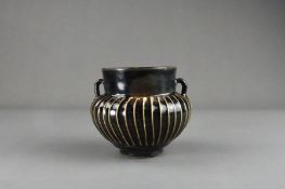 A Cizhou Black-glazed Ribbed Handled Jar, Song dynasty