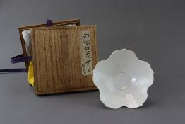 A Ding-type White-glazed floral plate, probably Five dynasties