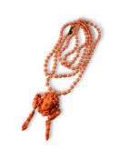 A Coral Brooch with the Head of Bacchus, c.1900, and a glass bead necklace imitating coral
