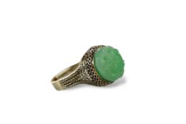 A Chinese sterling silver carved jade ring